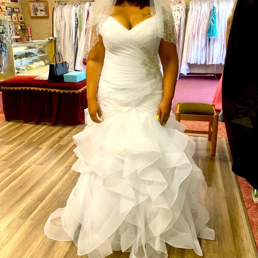 Morilee wedding dress will fit size 14-16.